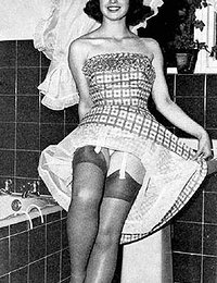 This time pretty chick poses in retro lingerie and changes her dresses from time to time